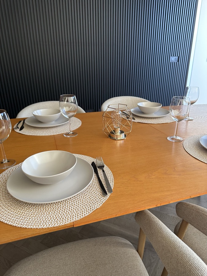 Table set with plates, bowls and wine glasses